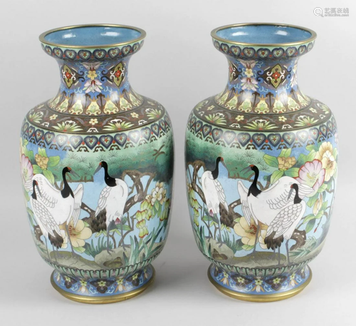 A pair of oriental cloisonné vases, each of tape…