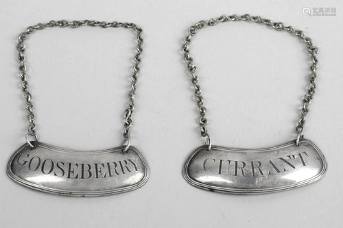 Two similar wine labels, each suspended from a chain