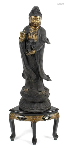 A large bronze study of Guan Yin, standing in flowing