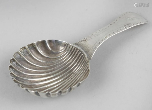 A George III silver caddy spoon, the shell bowl …