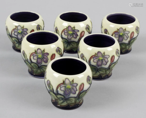 A set of six Moorcroft pottery egg cups, each with a