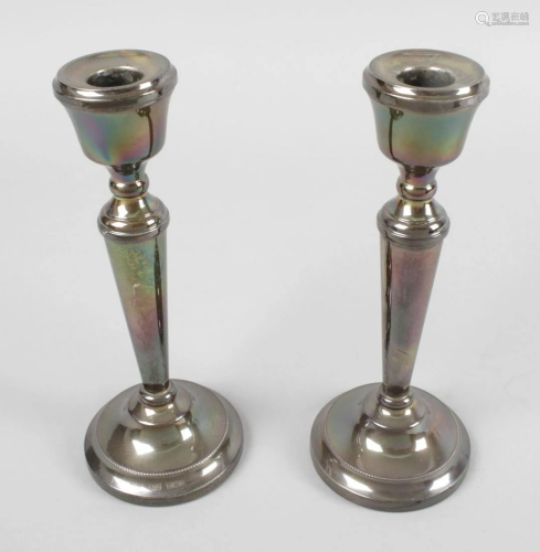 A pair of modern silver mounted candlesticks, each …