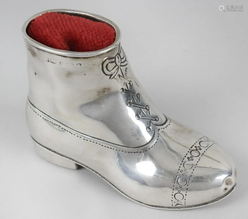 A late Victorian silver pin cushion, modelled as a boot