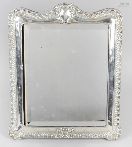 An Edwardian silver mounted mirror, the rectangular