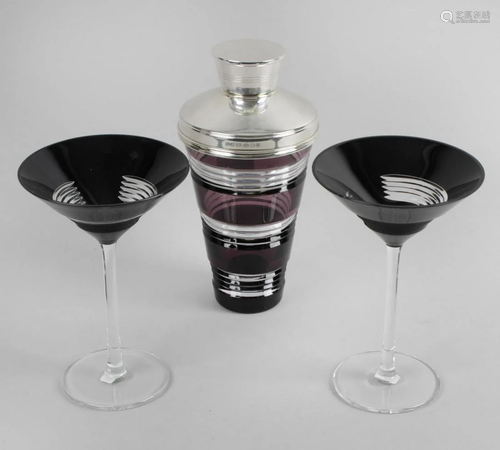 A modern glass cocktail shaker, the clear and purple