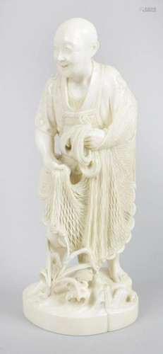 A 19th century carved ivory okimono, modelled as an