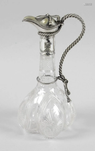 A Victorian cut glass claret jug, the cut glass lobed