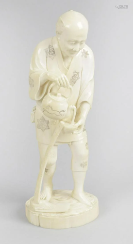 A 19th century carved ivory okimono, modelled as an