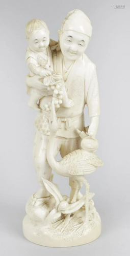 A 19th century carved ivory okimono, modelled as a