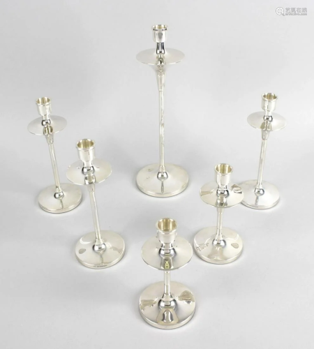 A graduated set of six modern silver candlesticks,