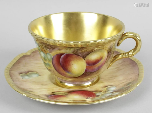 A Royal Worcester bone china cup and saucer, hand