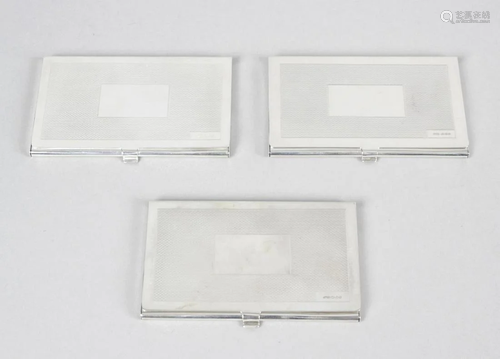 Three modern silver card cases, each of plain