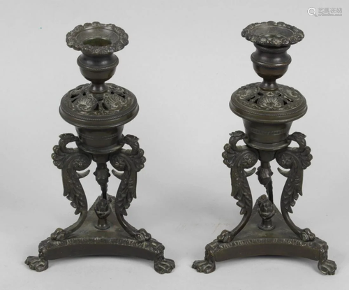 A pair of Regency bronze candlesticks, each wit…