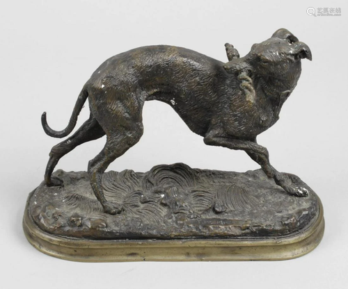 A spelter figure, modelled as a sighthound, po…