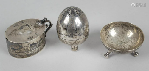 An Eastern white metal three piece part condiment set,