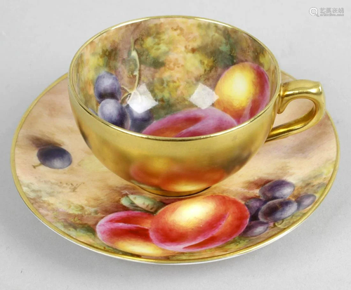 A Royal Worcester bone china cup and saucer, the cup