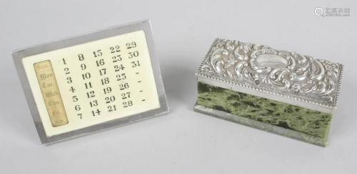 An silver mounted desk calendar, of rectangular form