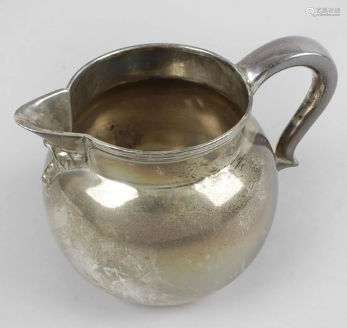 A modern silver cream jug, of plain bulbous form, the