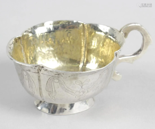 An 18th century Russian silver vodka cup, the cusped