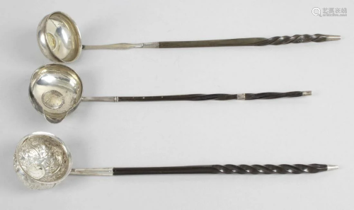 Three punch ladles, each with a baleen part twist stem