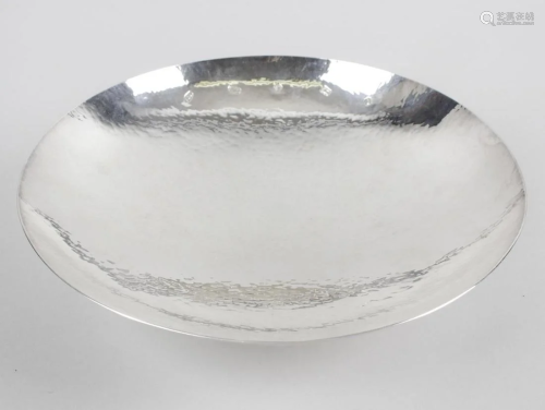 A modern silver dish, of circular footed form, with