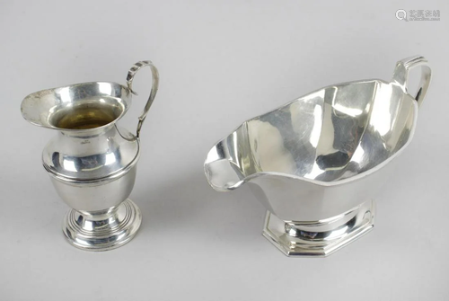 An early George V silver cream jug, of baluster form