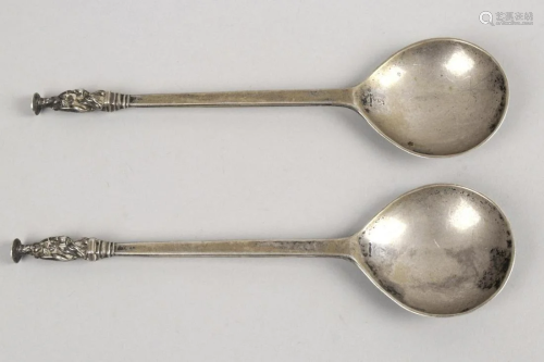 A pair of Apostle top spoons, each with plain circu…