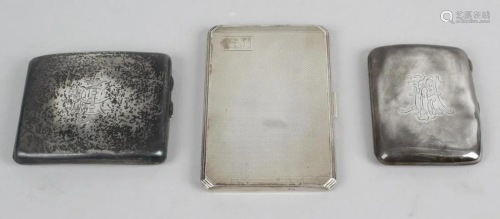 Three silver cigarette cases, the first of rectangular