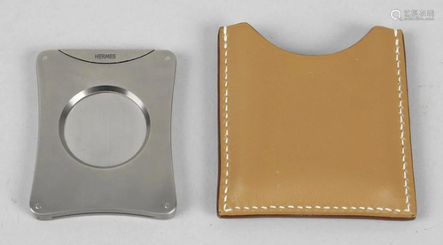 A brushed steel Hermes cigar cutter, of rounded