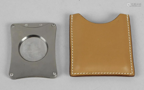 A brushed steel Hermes cigar cutter, of rounded