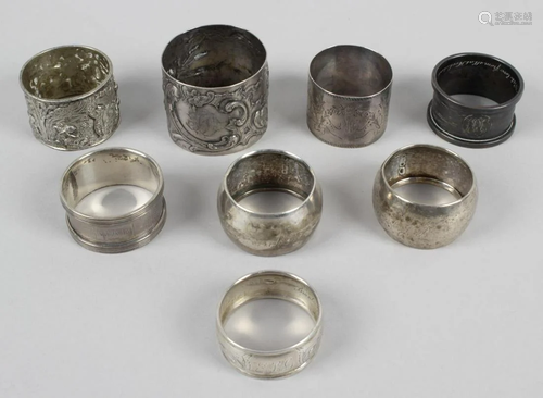 A selection of eight assorted silver napkin rings,