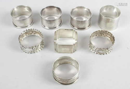 A selection of eight assorted silver napkin rings,