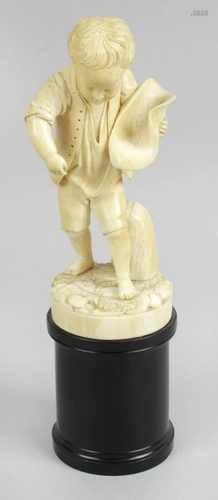 A 19th century carved ivory figure, modelled as a yo…