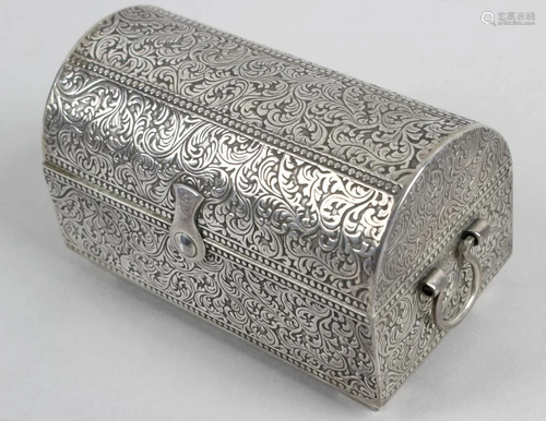 A modern silver box modelled as a treasure chest,