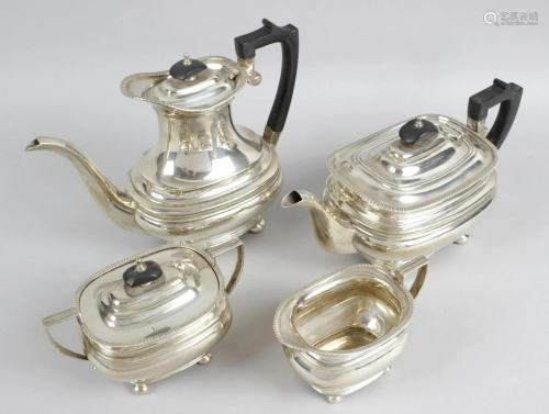 A modern silver four piece tea service, comprising