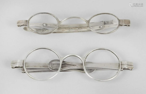 A cased pair of 19th century silver wig spectacles …