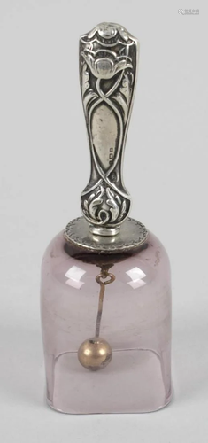 A small table bell, the pale amethyst glass body of