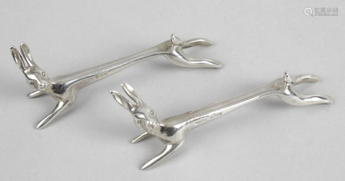 A pair of modern silver knife rests, each modelled as a