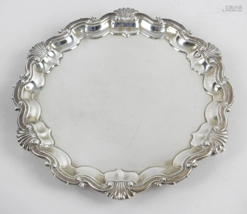 A late Victorian small silver salver, the circular form