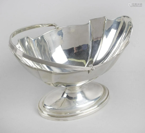 An Edwardian silver swing-handled sugar basket, of