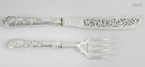 A pair of Victorian silver fish servers, each with