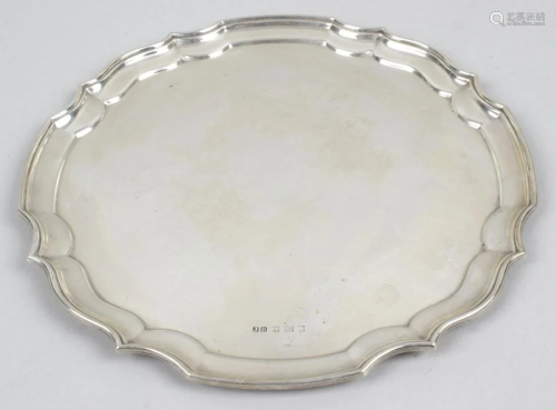 A modern silver salver, of circular form with pie crust