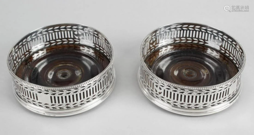 A pair of George III silver mounted wine coasters…