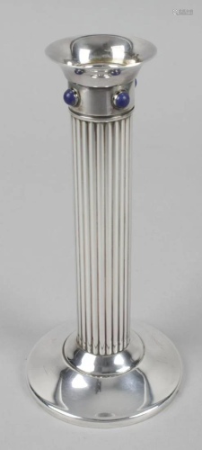 A Cartier silver plate candlestick, the spread circular