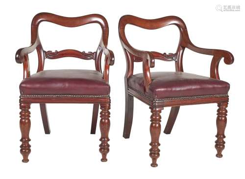 A pair of early Victorian mahogany balloon back armchairs