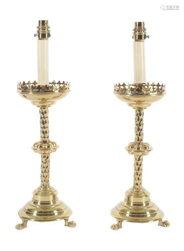 A pair of late Victorian brass table lamps in the manner of altarsticks