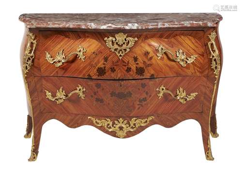 ϒ A kingwood, tulipwood inlaid, and gilt metal mounted commode in Louis XV style