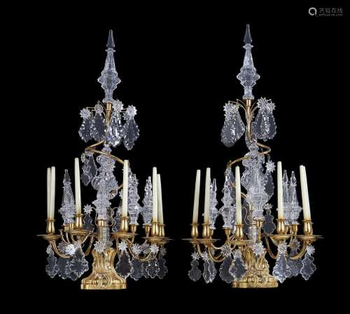 A pair of cut glass and gilt metal six light lustre candelabra in Louis XV taste