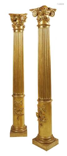 A pair of carved and giltwood columns