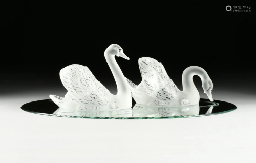 A PAIR OF LARGE LALIQUE CRYSTAL SWANS AN…